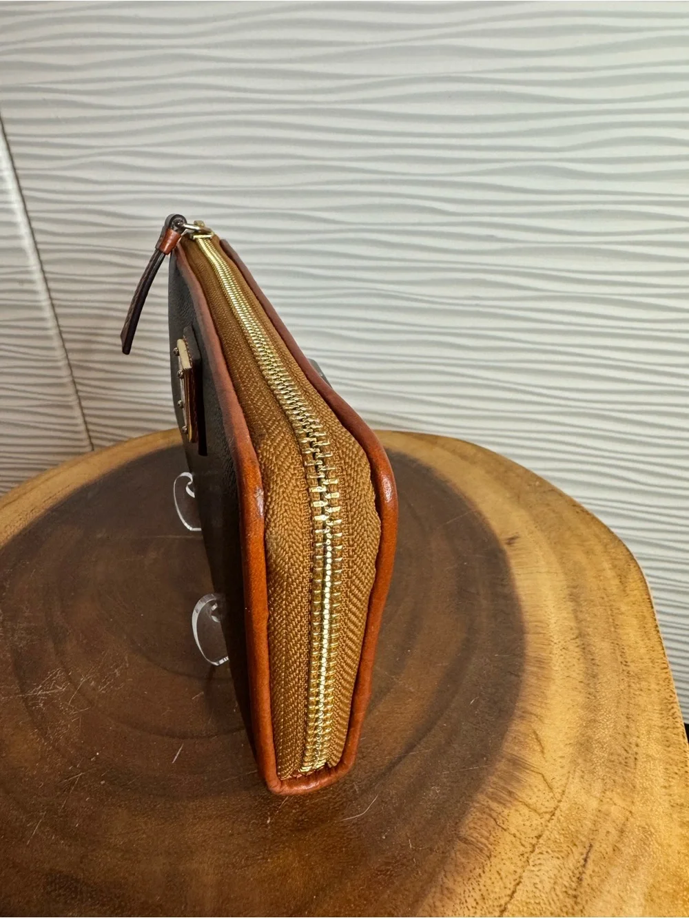 Dooney & Bourke Black Pebbled Leather Zip Wallet with Tan Trim and Logo Plate